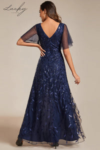 Vestido azul navy con hojas y mangas