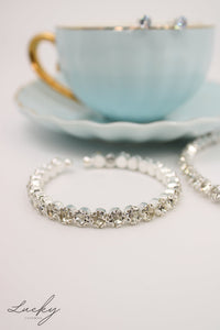 Set de collar, brazalete y arete plateado