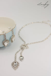 Set de collar y arete plateado