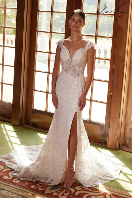 Vestido blanco al cuerpo con brillos