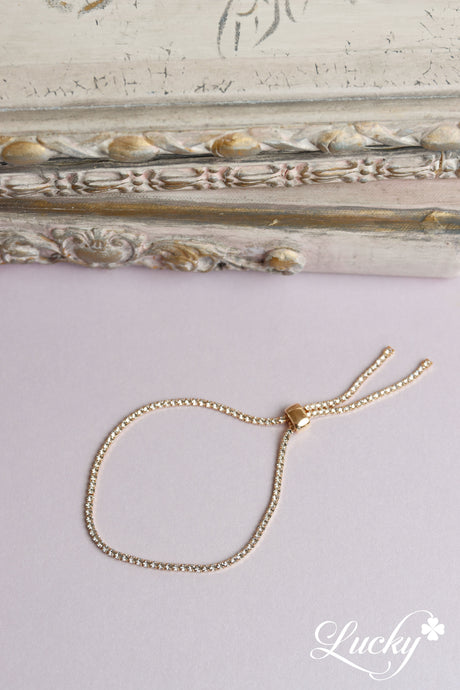 Brazalete dorado ajustable de una fila sencilla