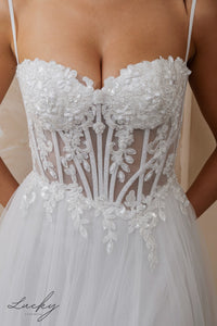 Vestido blanco con piedras y tirantes