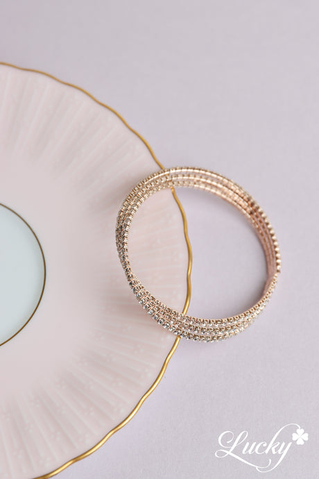 Brazalete oro rosa de tres filas cruzadas juntas